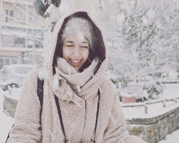 Portrait of smiling woman in snow