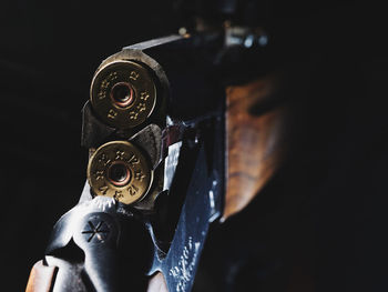 Close-up of shotgun in darkroom