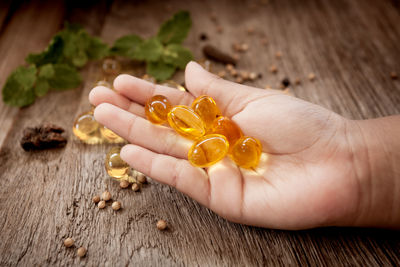 Close-up of hand holding medicine