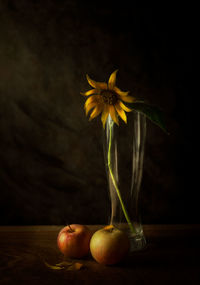 Close-up of yellow flower in vase on table