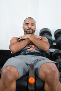 Portrait of man exercising in gym