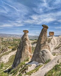 View of rock formation on landscape against sky