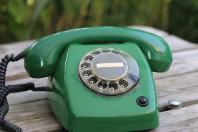 Close-up of telephone booth on table