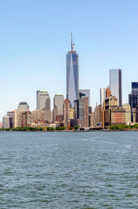 View of buildings in city against clear sky