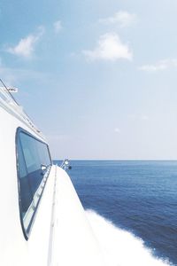 Cropped image of boat sailing in sea