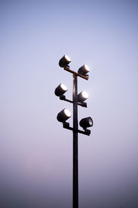 Low angle view of lighting equipment against clear sky