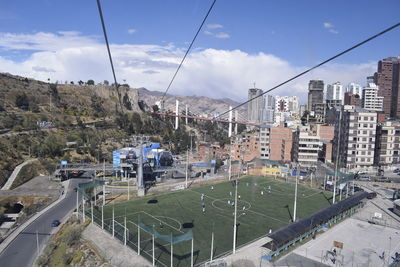 High angle view of buildings in city against sky