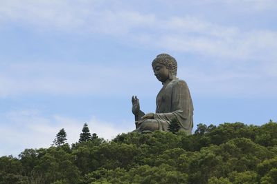 Low angle view of statue against sky