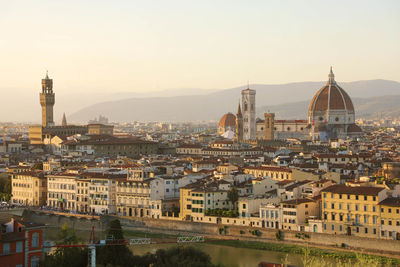 River arno with palazzo vecchio palace and cathedral of santa maria del fiore, florence, italy