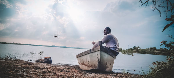 Man on beach against sky