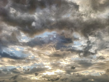 Low angle view of cloudy sky during sunset