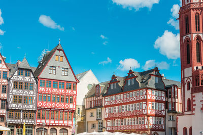 Low angle view of buildings against blue sky