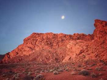 Low angle view of rock formation against sky