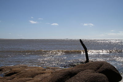Close-up of sea against sky on beach