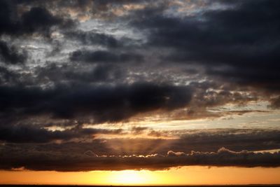 Low angle view of dramatic sky during sunset