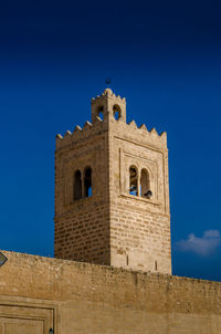 Low angle view of building against blue sky