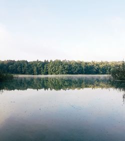 Scenic view of calm lake against clear sky