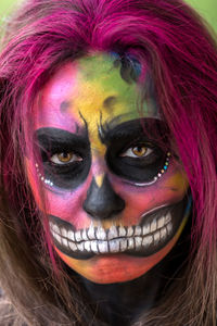 Close-up of woman with face paint