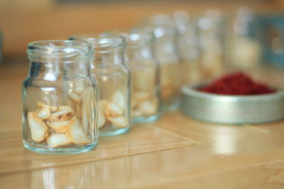 Close-up of glass jar on table