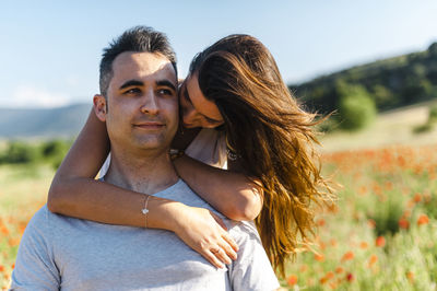 Portrait of couple kissing outdoors