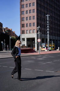 Side view of woman standing on street