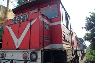 Close-up of red car on white background