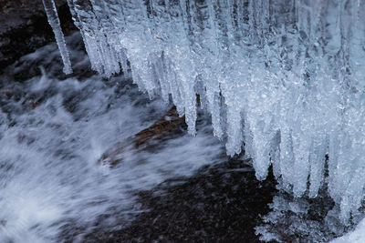 Frozen waterfall in forest