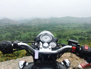 High angle view of cars on mountain against sky