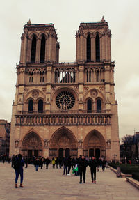 Tourists in front of building