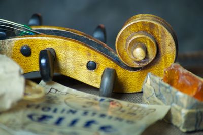 Cropped image of guitar on table