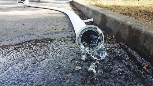 High angle view of water flowing from car