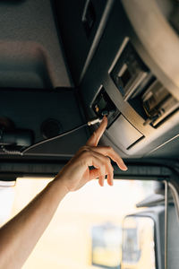 Cropped hand of man using mobile phone