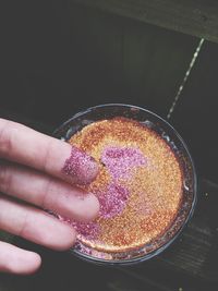 Glitter shiny powder spread on finger