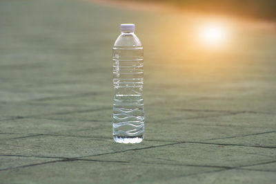 Close-up of glass bottle on table