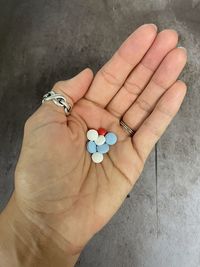 Cropped hand of person holding heart shape