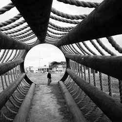 Woman standing on bridge