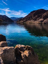 Scenic view of lake against blue sky