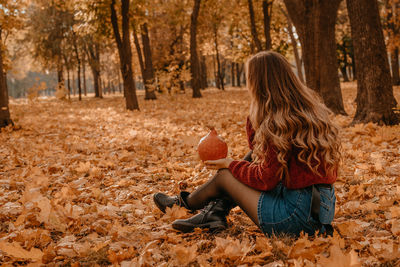 Woman sitting in autumn