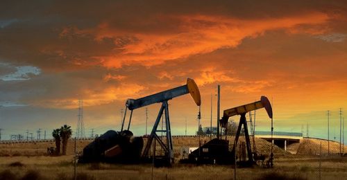 Oil field against clouds