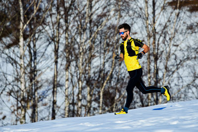 Man running on snowy land