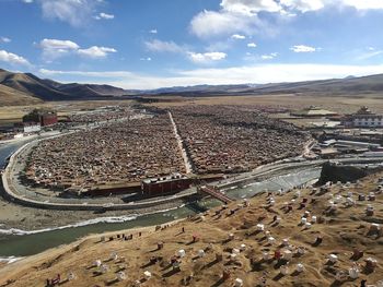 High angle view of crowd in city against sky