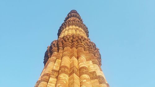 Low angle view of cross against clear sky