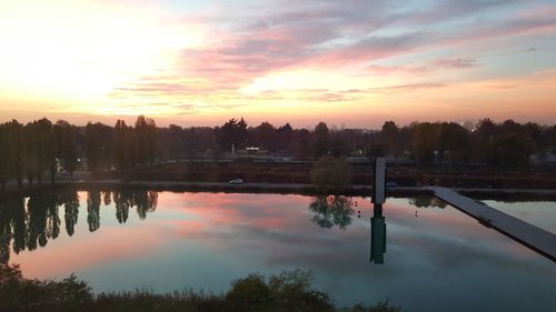 Scenic view of lake against sky during sunset