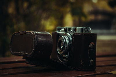 Close-up of camera on table