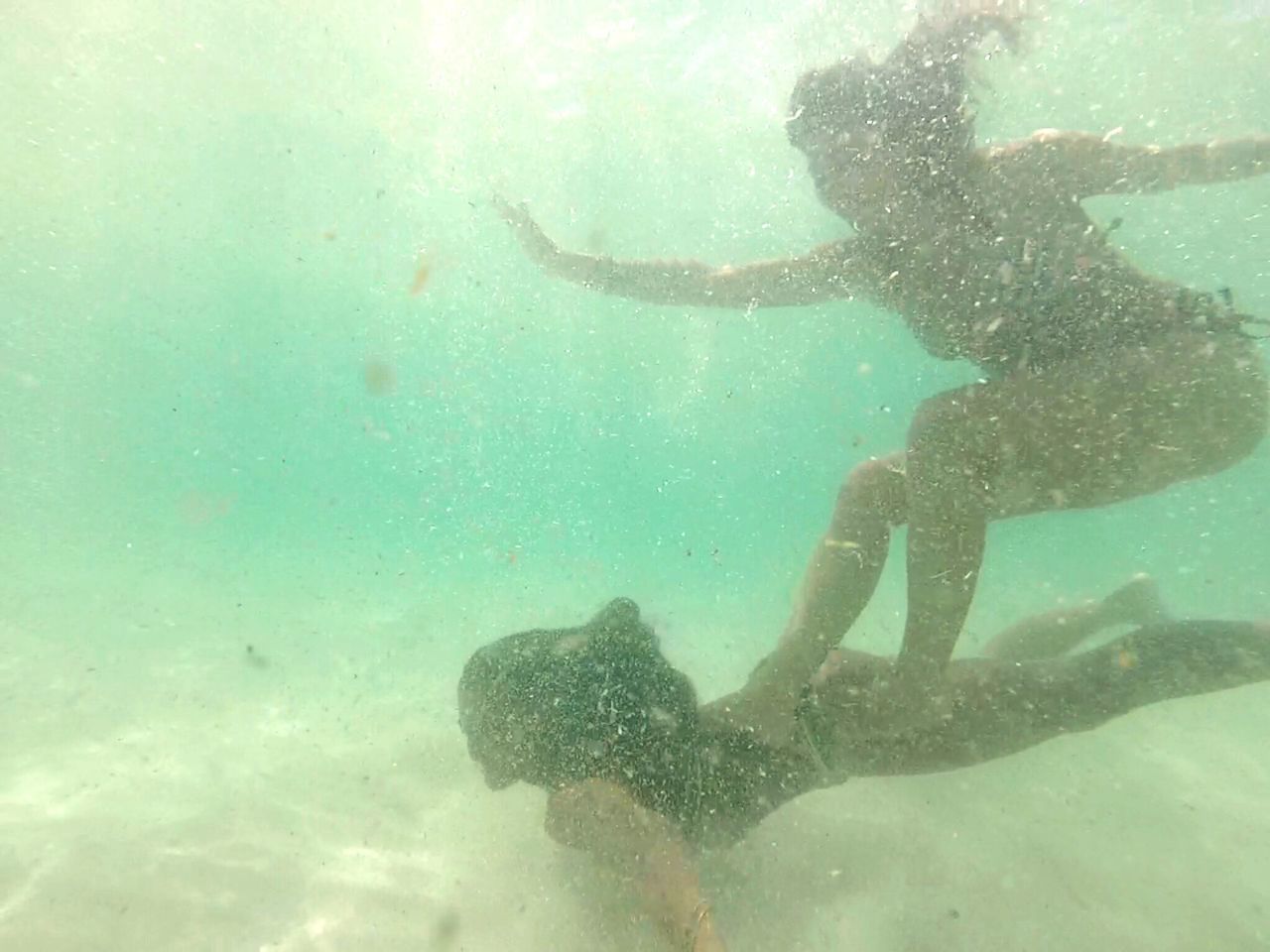 WOMAN SWIMMING IN SEA