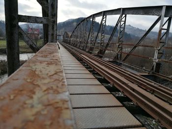 Close-up of railroad tracks against sky