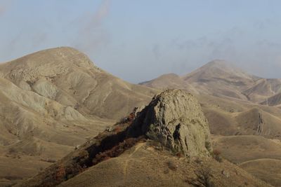 Scenic view of arid landscape against sky