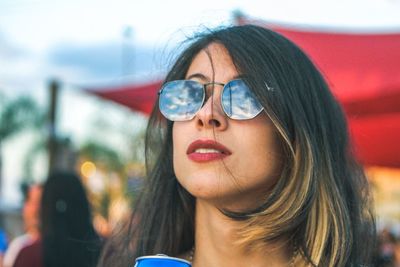 Young woman wearing sunglasses