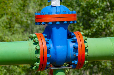 Close-up of pipes against blue sky
