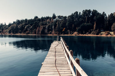 Pier over lake against sky